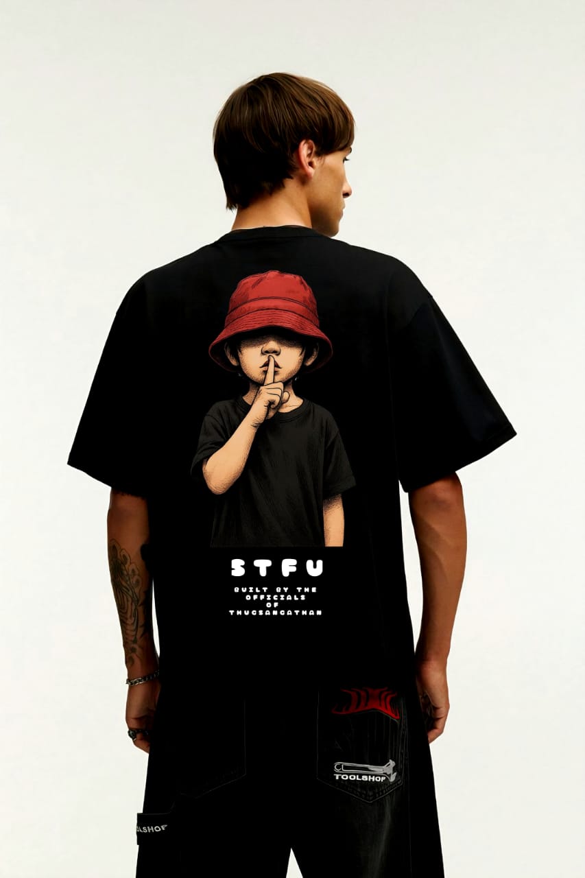 Person wearing a black t-shirt with a graphic of a child and text 'STFU' on the back.