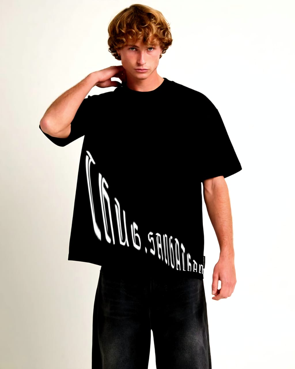 Person wearing a black t-shirt with white text on a plain background